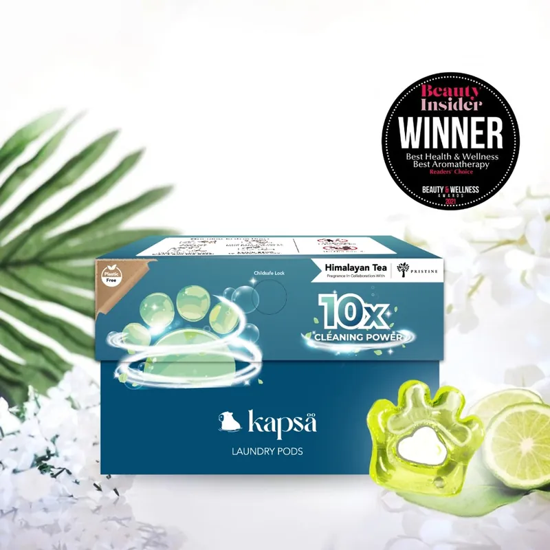 A box of Kapsä Himalayan Tea laundry pods with a paw-shaped pod