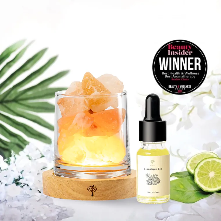 Himalayan salt lamp with an aroma concentrate bottle